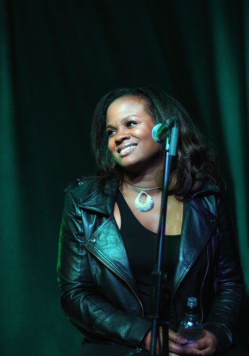 Marcia smiling at the microphone